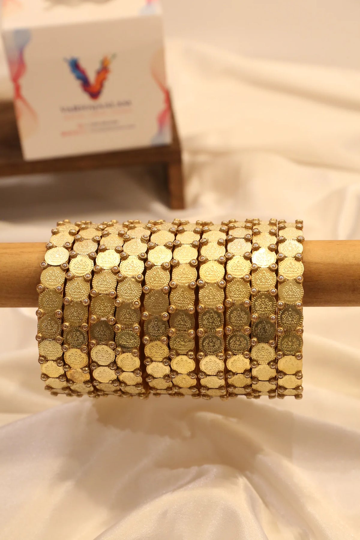 Handcrafted thread bangle with coin detailing