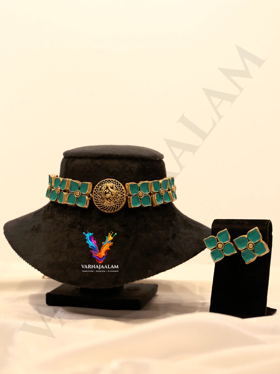Handcrafted terracotta choker necklace featuring light turquoise four-petal floral stones, a circular carved gold center pendant, and matching floral stud earrings