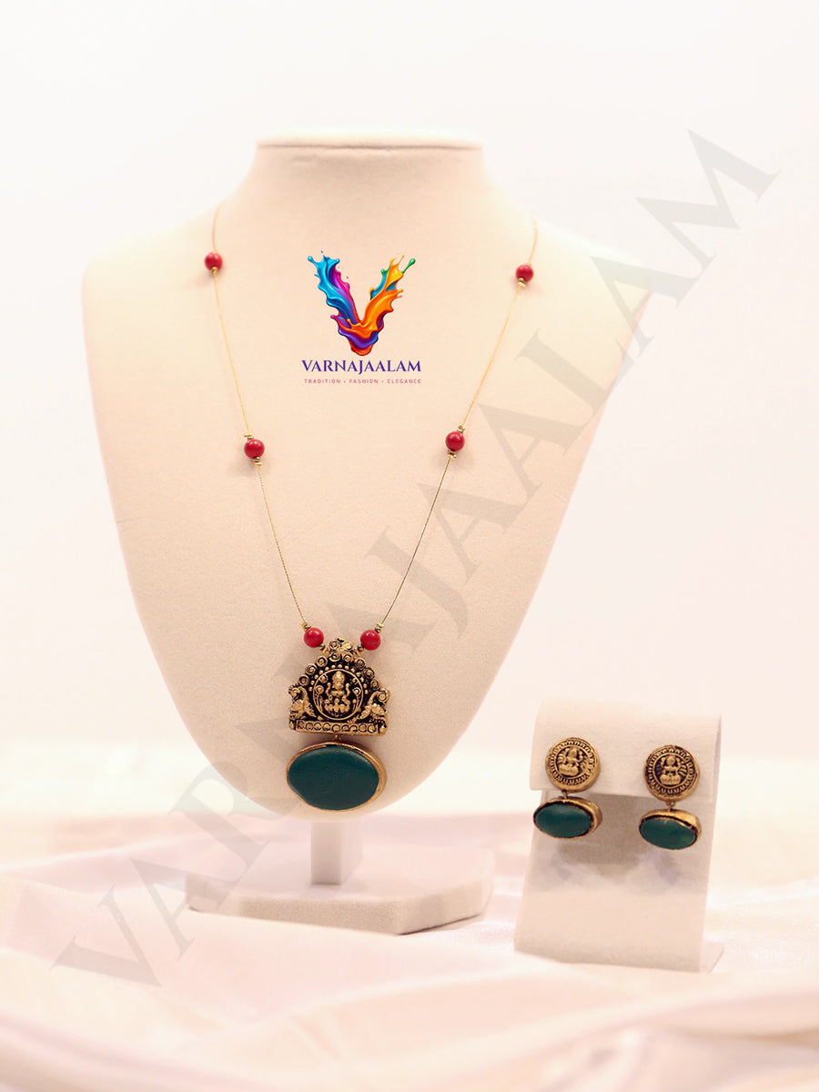 Terracotta Lakshmi pendant on invisible wire chain with green stone drop and matching earrings