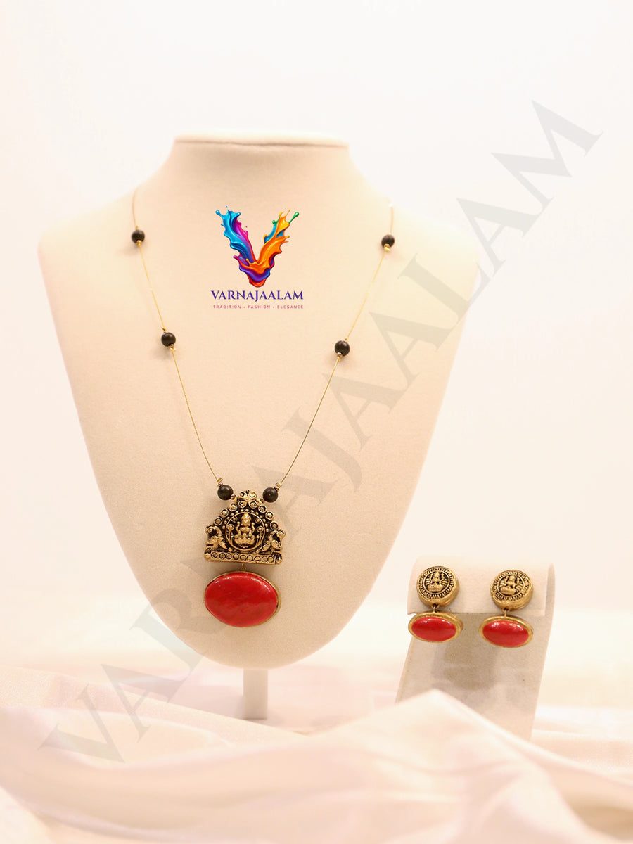 Terracotta Lakshmi pendant on invisible wire chain with red stone drop and matching earrings