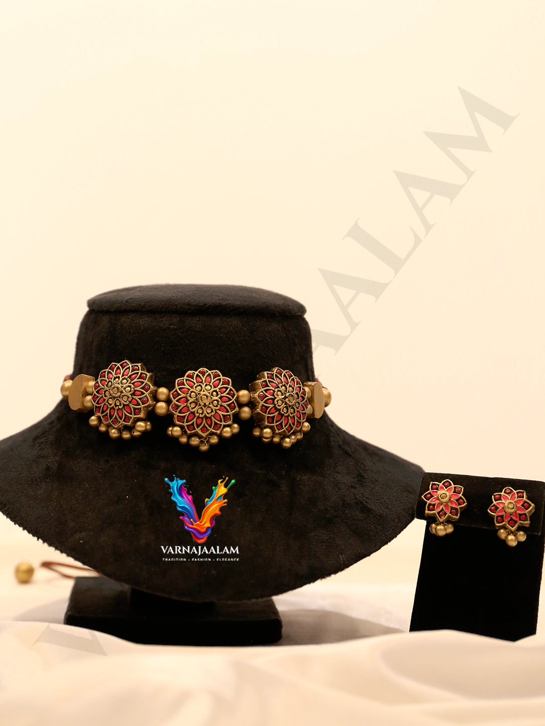 Terracotta choker with red circular floral medallions, antique gold beads, and matching flower earrings