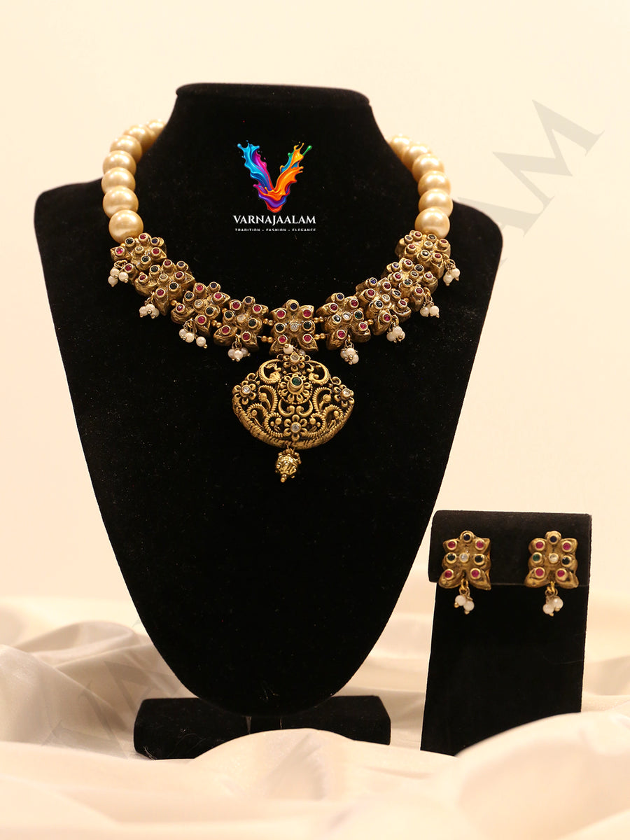 Terracotta cream pearl choker with multi-color floral motif band, pendant, and matching earrings