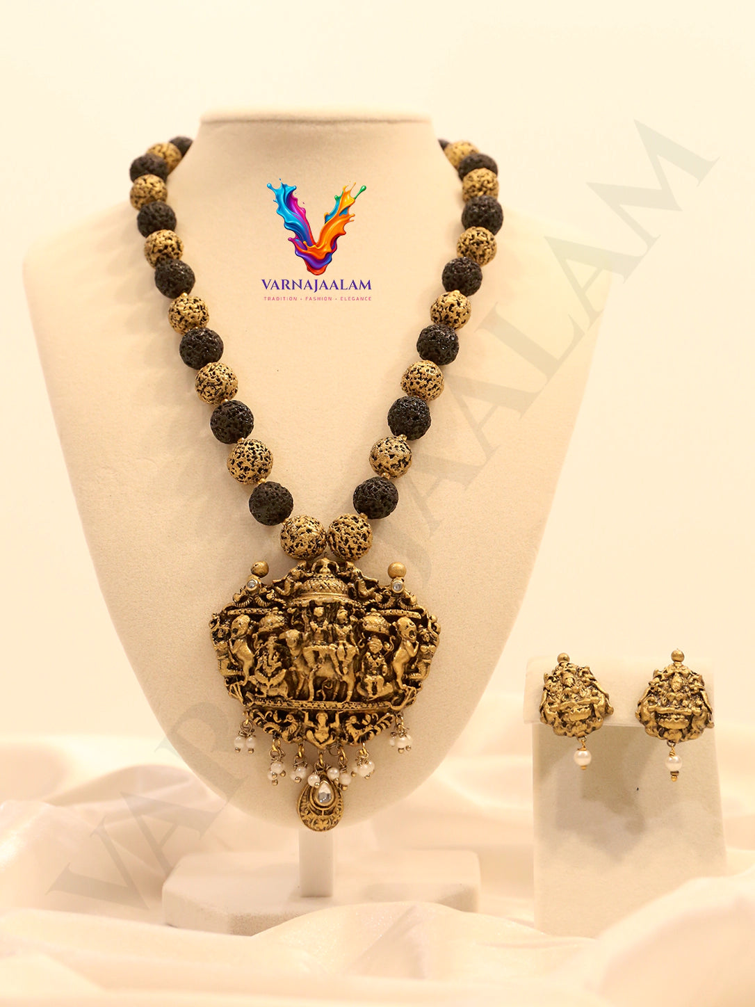 Terracotta long mala with textured black and gold beads, antique temple pendant, and matching earrings