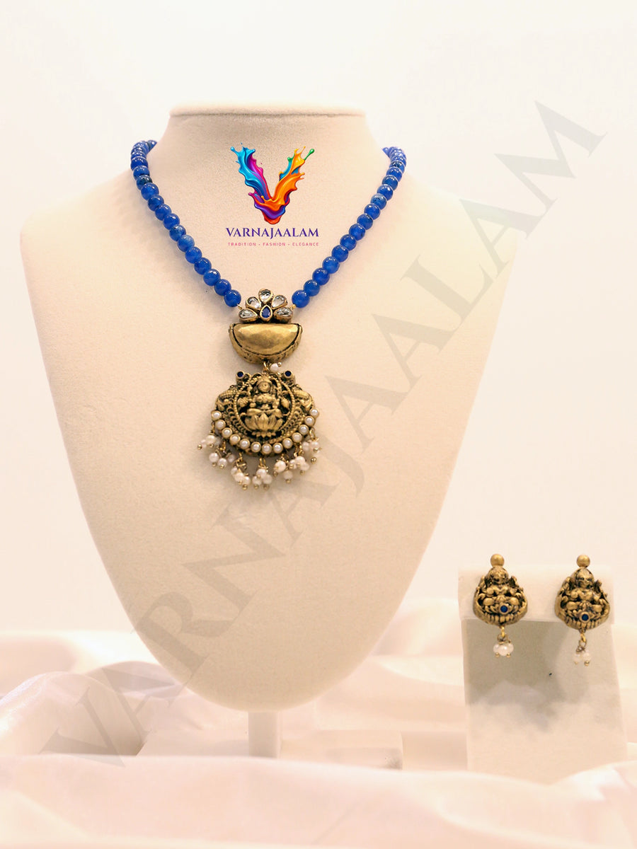 Terracotta royal blue bead mala with antique Lakshmi temple pendant, pearl fringe, and matching earrings
