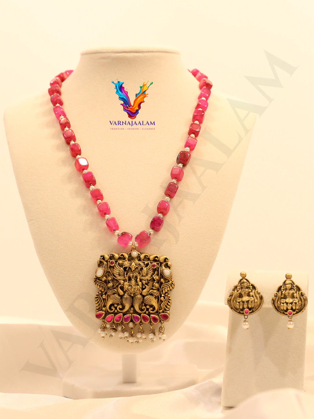 Terracotta long mala with vibrant pink/ruby tumbled beads, antique square Lakshmi temple pendant with pink stone accents, pearl drops, and matching earrings
