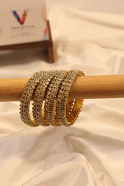 Double-line kundan bangle with leaf motif