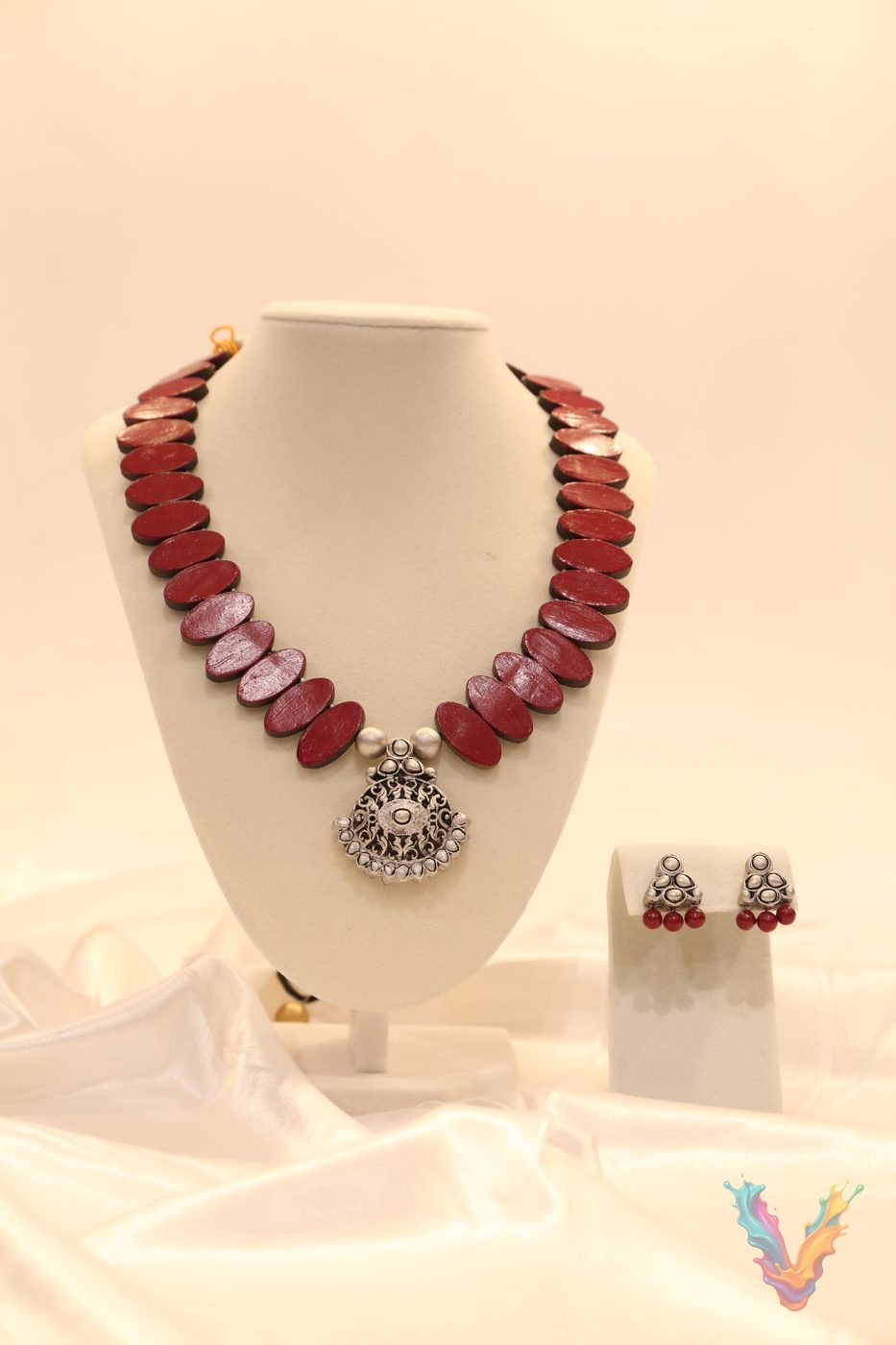 Pink and gold terracotta necklace with a pendant and earrings